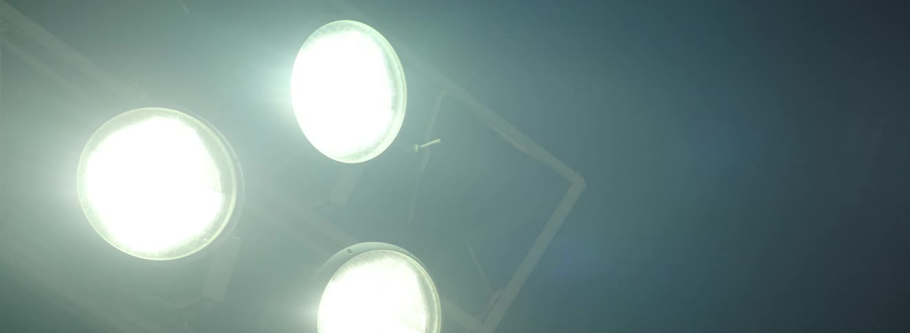 Three spotlights with white light and they are getting brighter and brighter