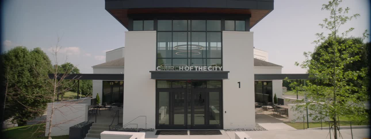 Facade of a modern building surrounded by greenery