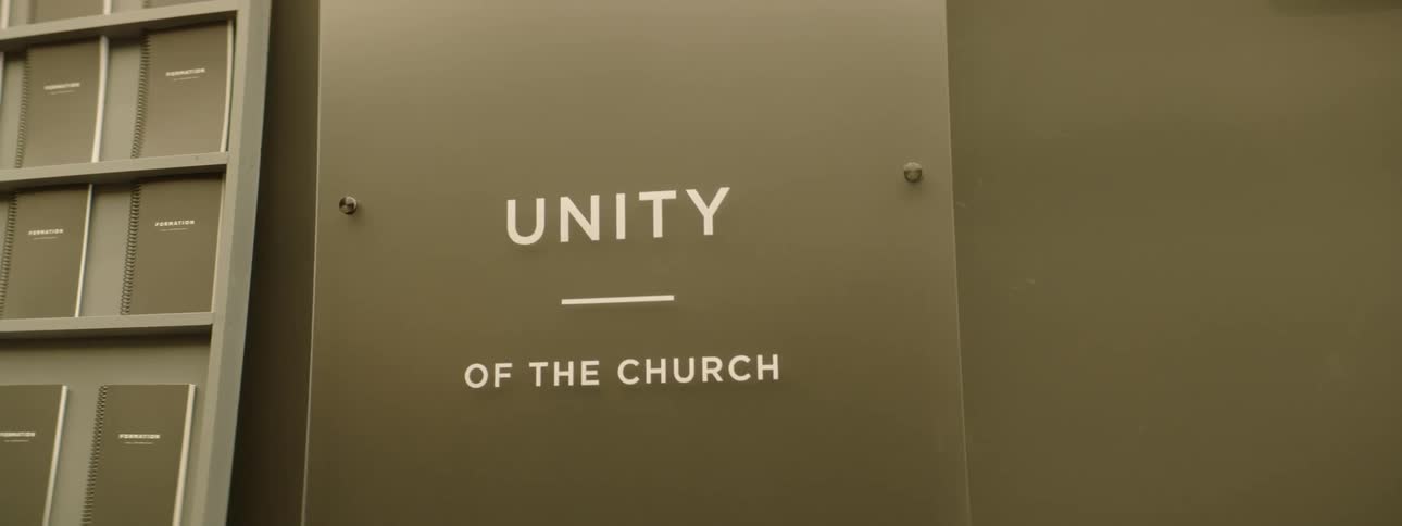 A sign in the church displays the name