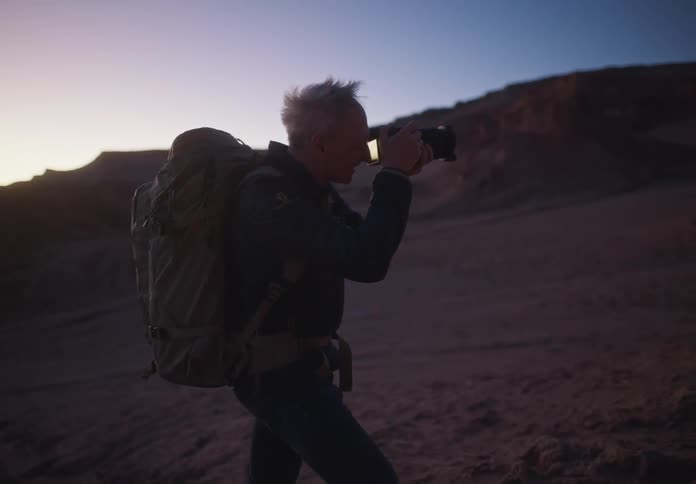 Photograph taking photos with a professional camera in a canyon