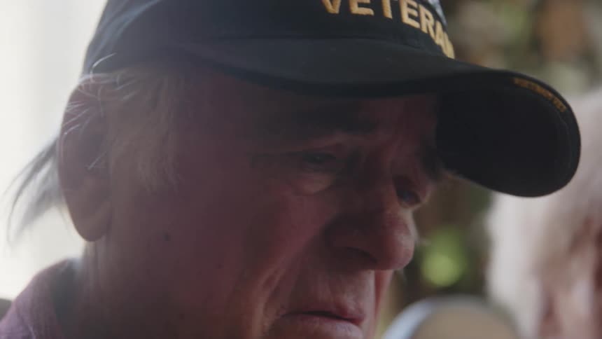 Portrait of an emotional elderly man talking to a lady at his side