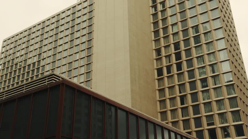 Facade of a modern building with a repeating pattern of square windows