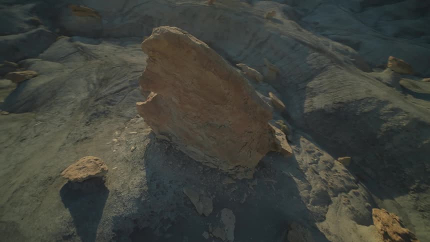 Rock amidst desert mountains