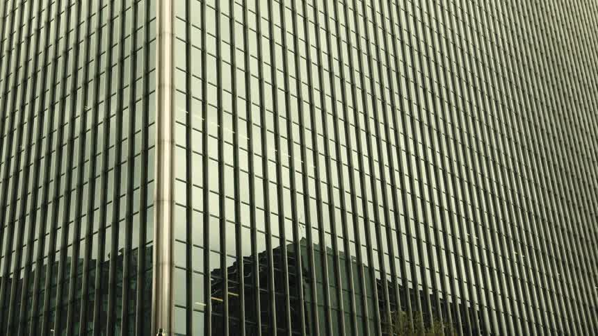 Exterior of a large modern mirrored building