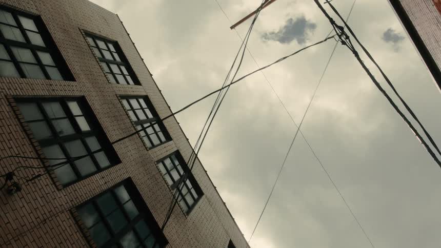 Clouds cover the sky over the building