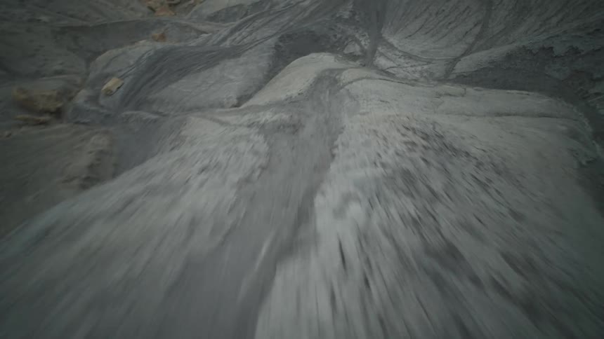 Shorter mountains and hills near a flat plain area