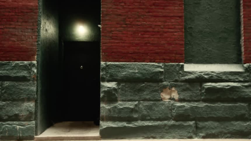 A building with cracked bricks in a city