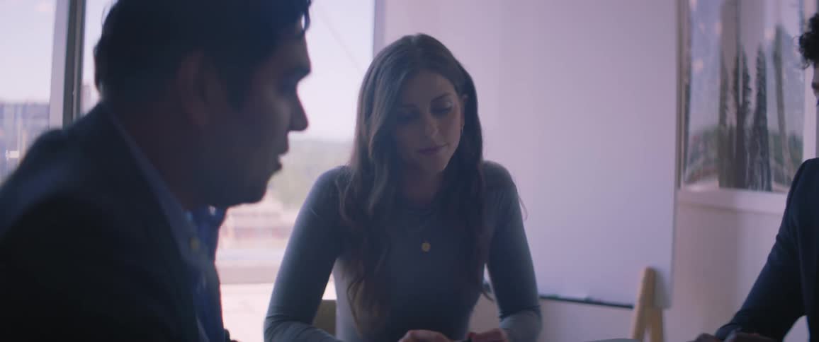 Coworkers have a discussion during a meeting