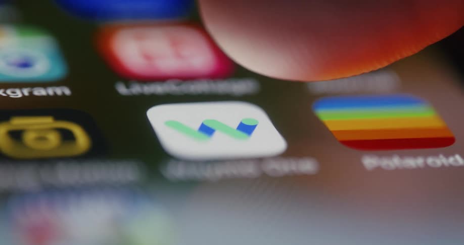 A person is deleting apps on their phone