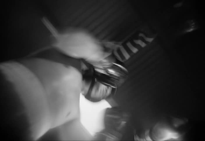 Sped up black and white footage of two women boxing on a ring