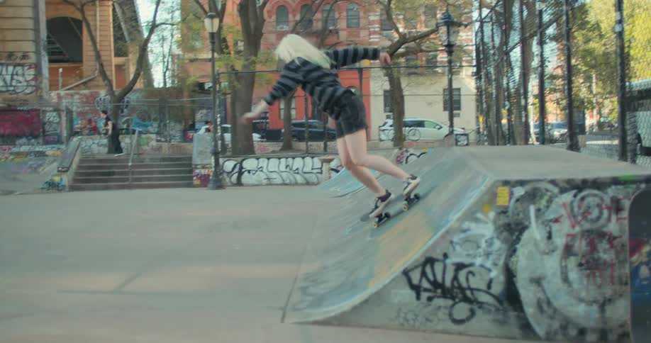 People in a skate park doing tricks