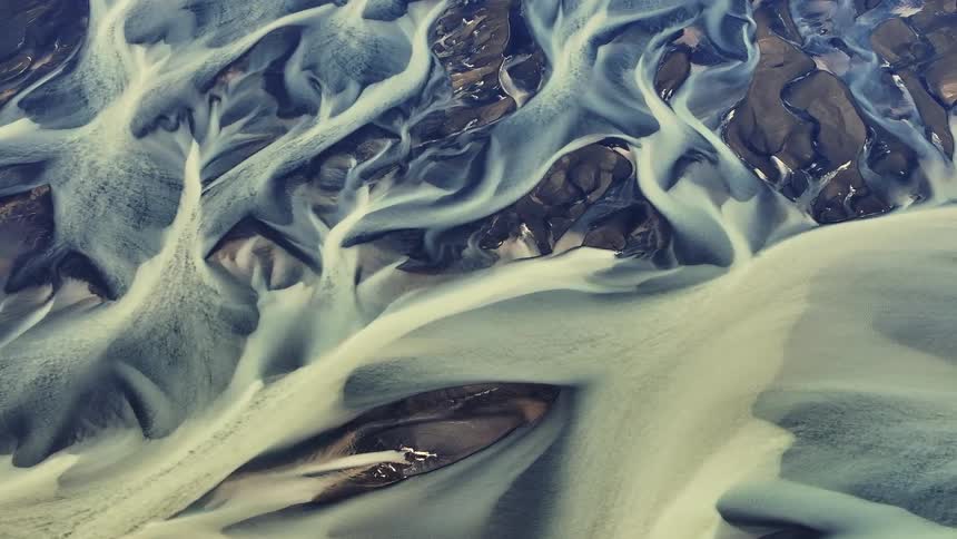 Flow pattern of water and sediment that creates shapes and textures
