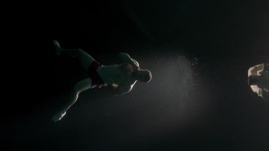 A man is punching underwater