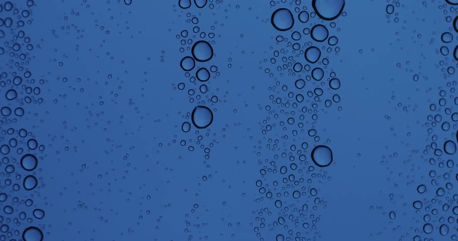 Drops of water on a blue glass surface