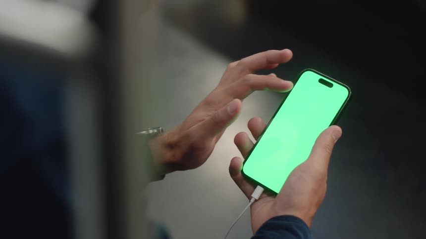 Closeup of a hand using an iphone