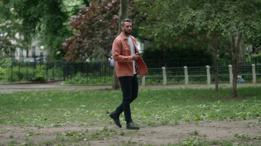 Man walking and talking on cell phone