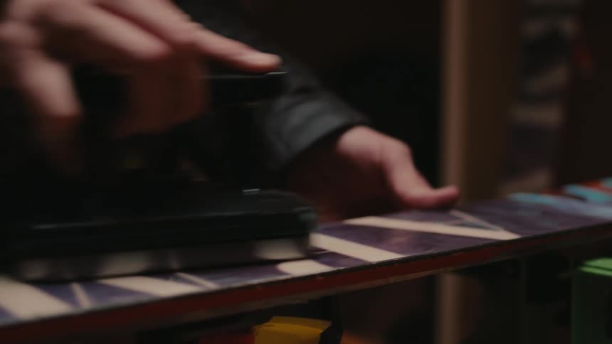 A man is buffing a sign