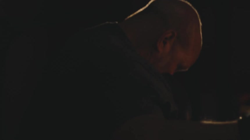 Man with gloves punching a boxing bag