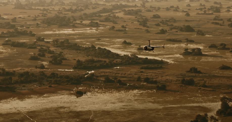Helicopter flying above a natural zone