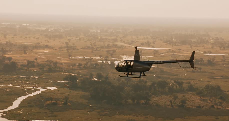 Helicopter flying over a jungle area