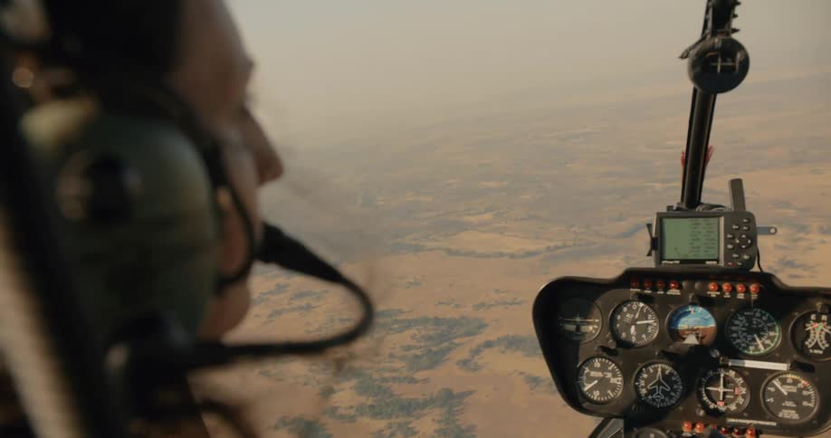 A woman is flying her helicopter on a foggy day