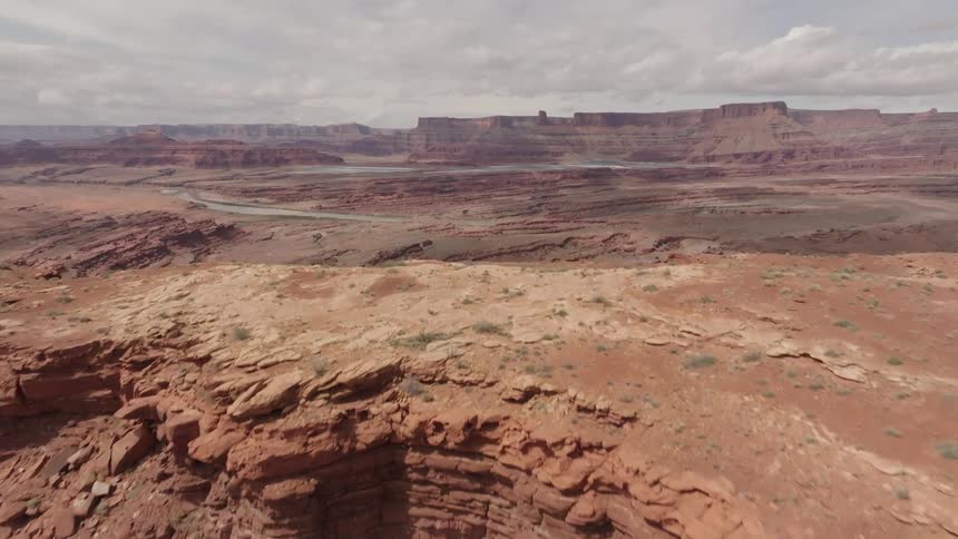 A vast canyon sitting between two mountain ranges