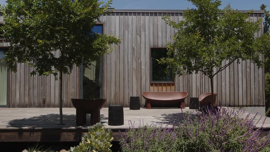 Garden outside a house with chairs