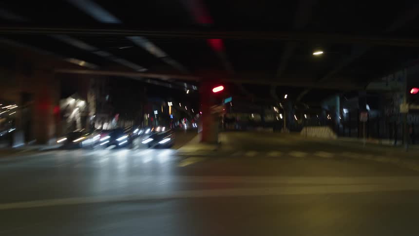 Streaks of white yellow and red lights of city life after dark