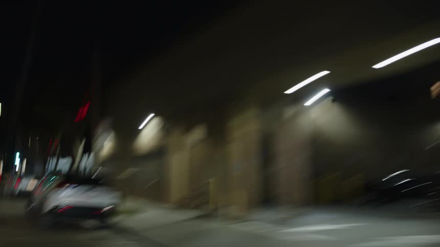 Moving view of a night street in an urban city