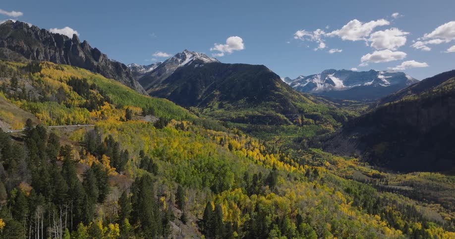 Aerial mountain landscape with colorful conifers