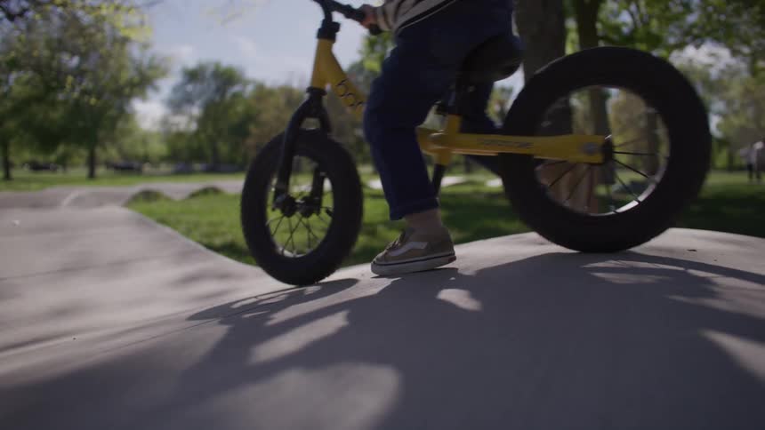 A child rides his bicycle
