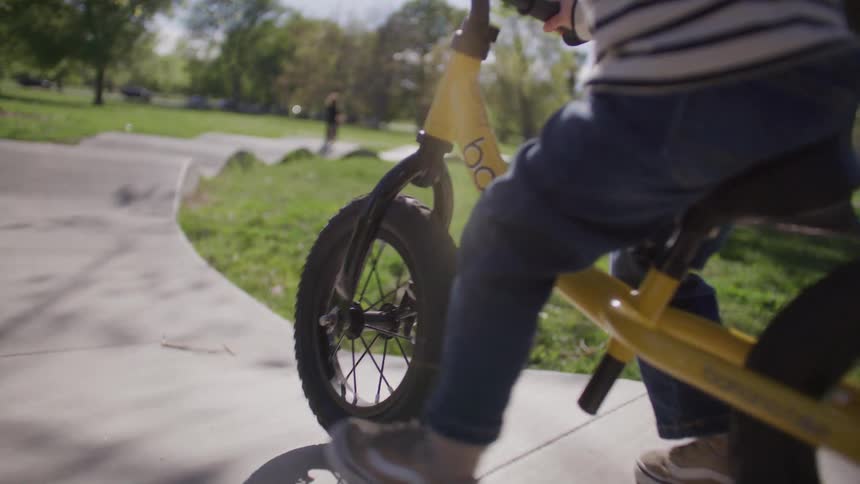 A child is riding his bike