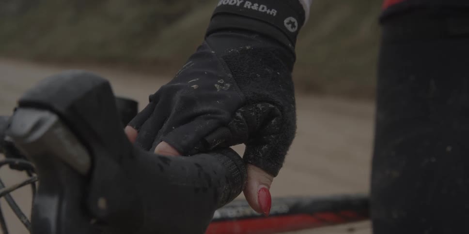 Woman's hand holding handle bar of bicycle