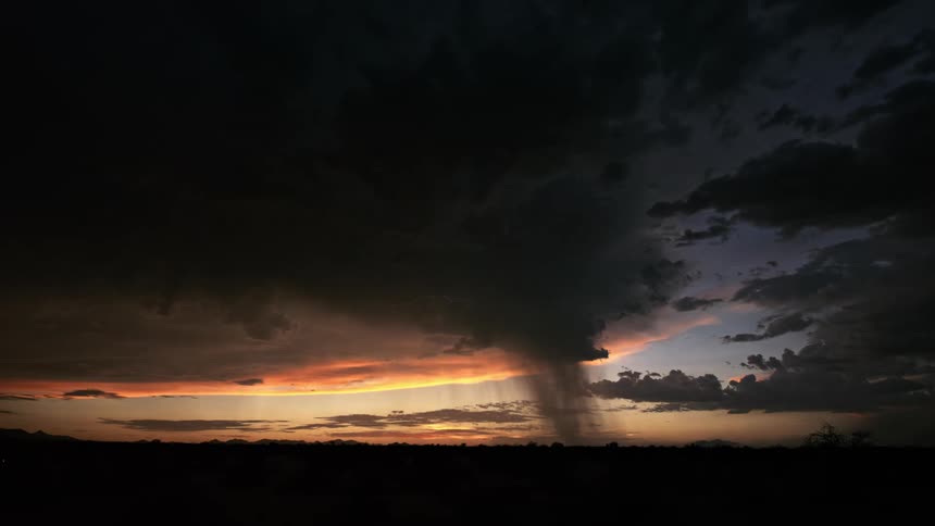 Lightning storm at sunrise with clouds covering the sky