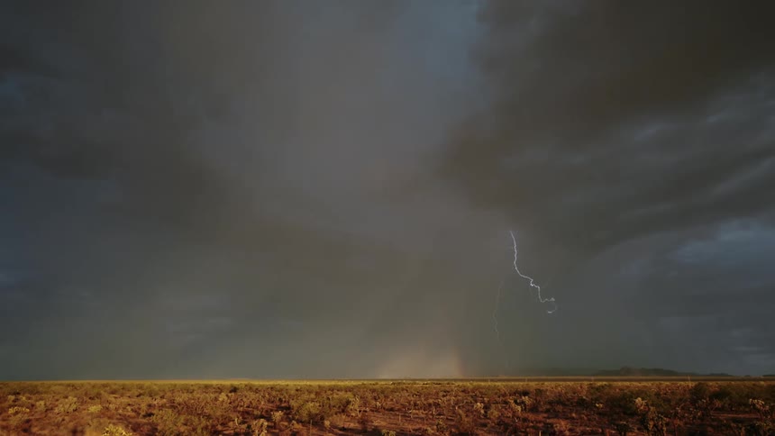 Lightning and rain falls from the clouds