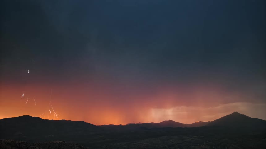 A dramatic thunderstorm with lightning strikes against a dusky sky