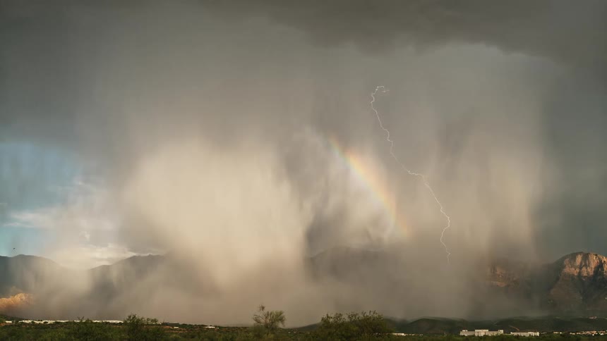 The storm clouds cover the mountains