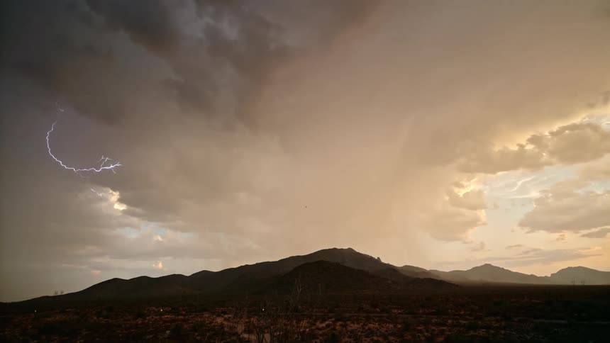 Lightning is spreading through the clouds as a storm forms