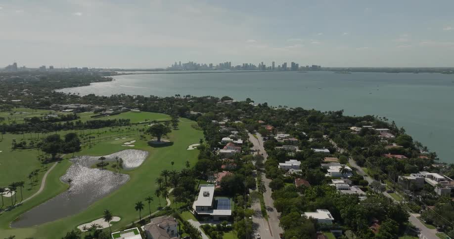 An aerial view of a vibrant coastal city in florida the coast stretches toward the horizon