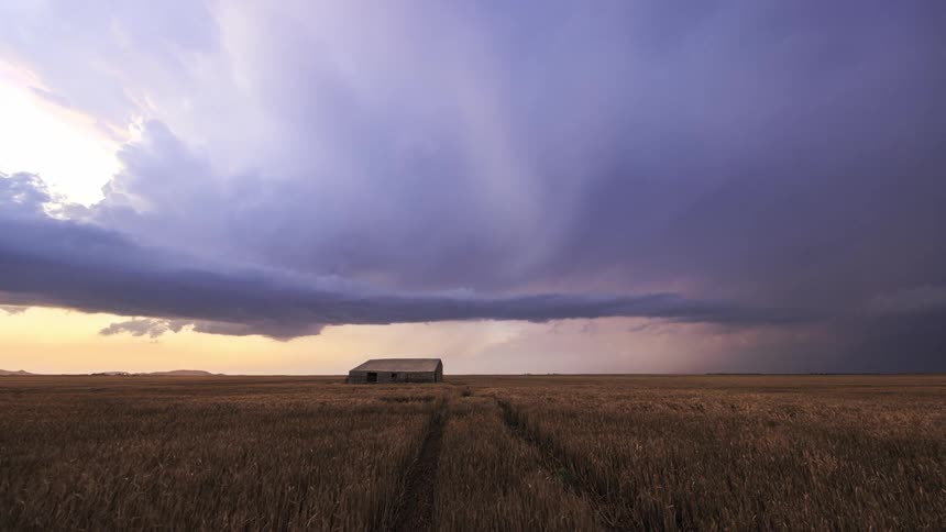 Storm clouds roll over the farm and pour rain