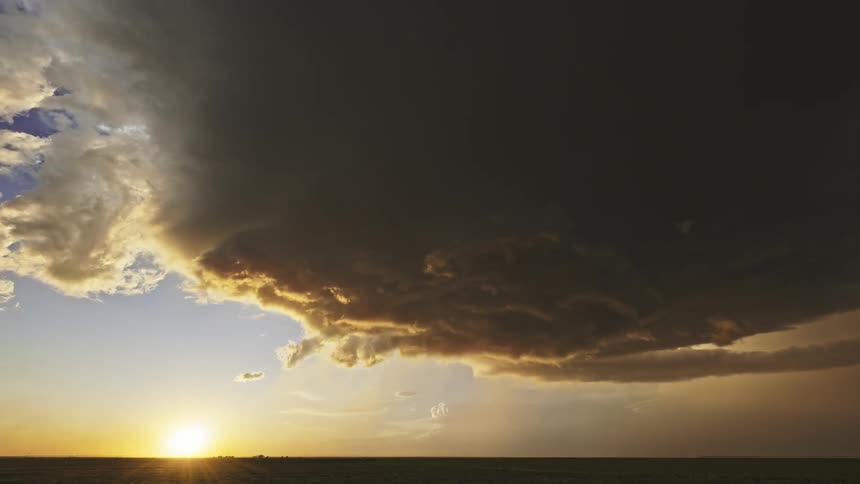Landscape of the sun on the horizon and the storm dissipating