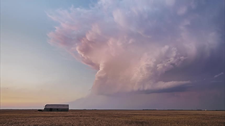 Heavy storm clouds move past the barn