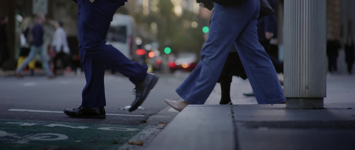 Pedestrians crossing a street in a metropolis