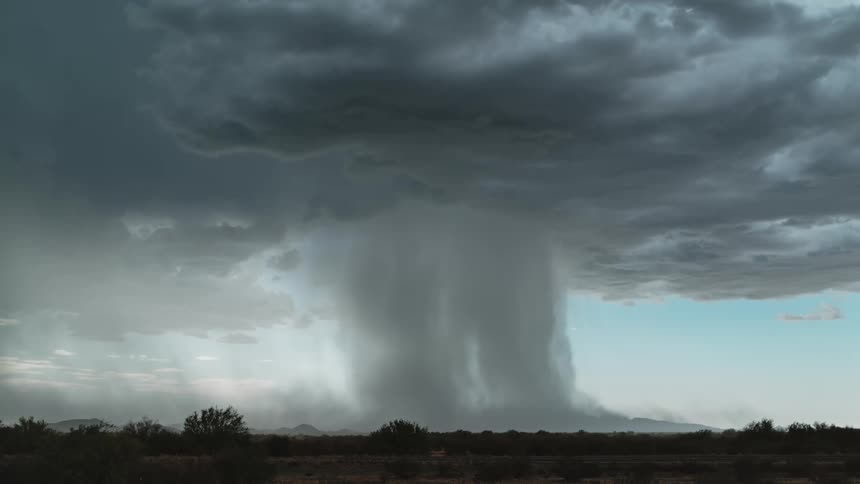 The large storm clouds pour heavy rain