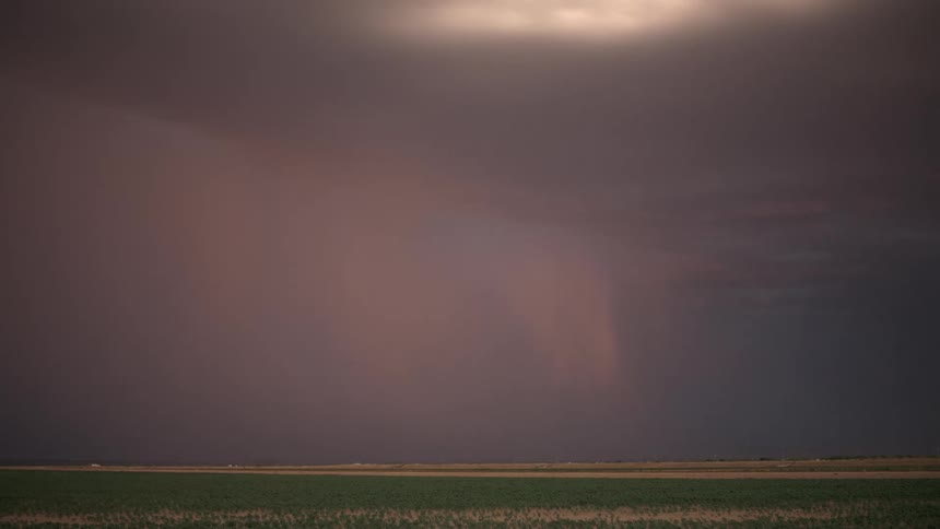 A dramatic thunderstorm with lightning strikes against a dusky sky