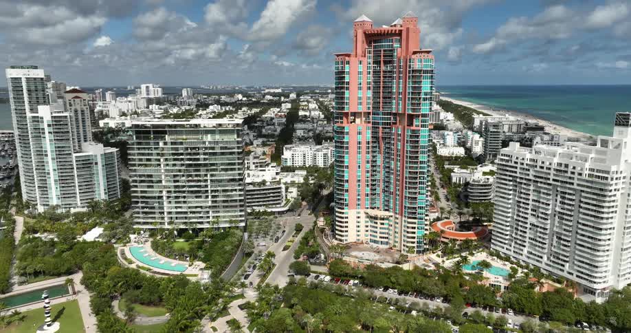Aerial of hotels in a vacation destination on an ocean coastline