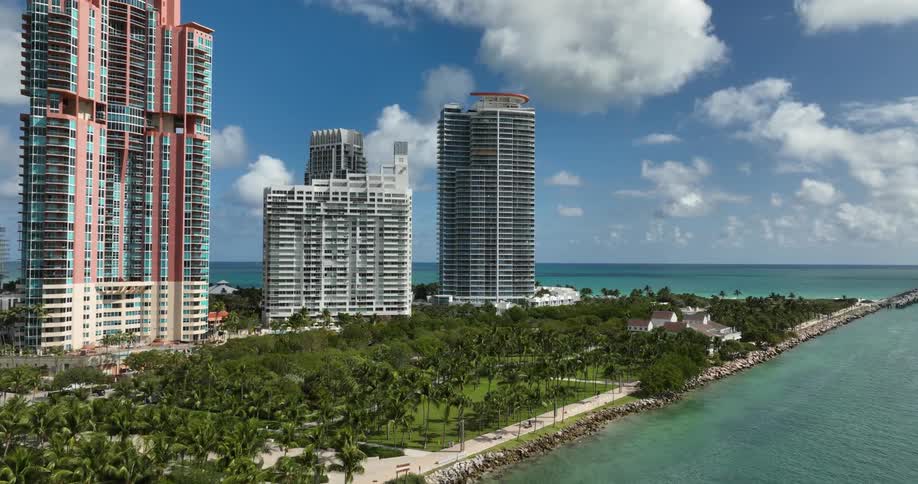 Coastal cityscape with modern skyscrapers along the coast with blue ocean