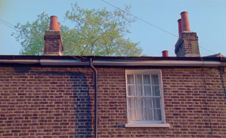 A window on a red brick wall