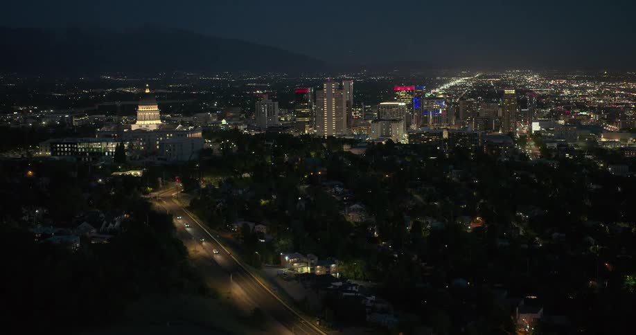 Night view of an illuminated city with tall buildings in the background