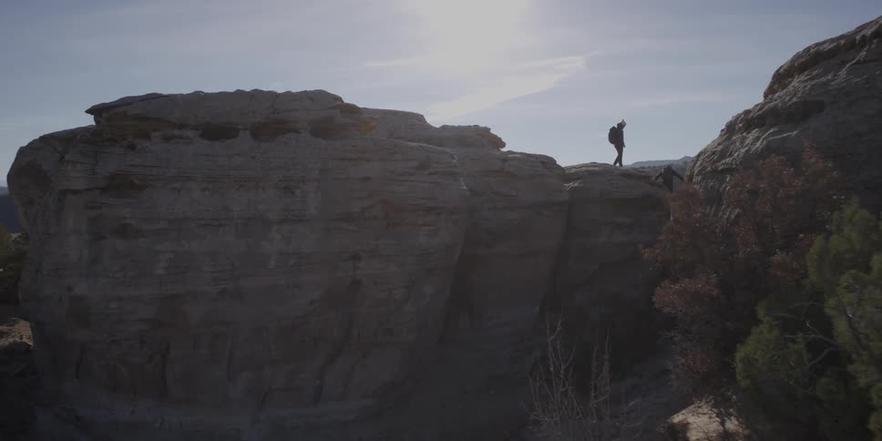 Two people hiking on a mountain